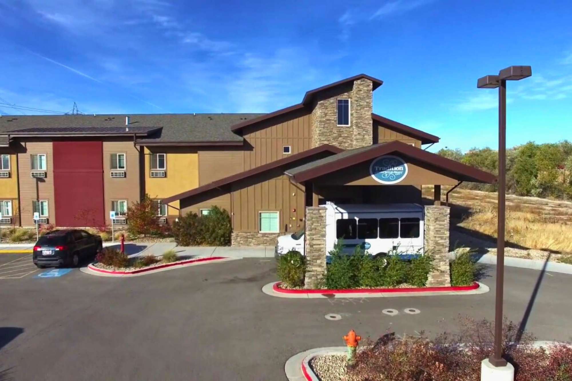 View of Tradition Assisted Living front parking lot in West Valley City, UT