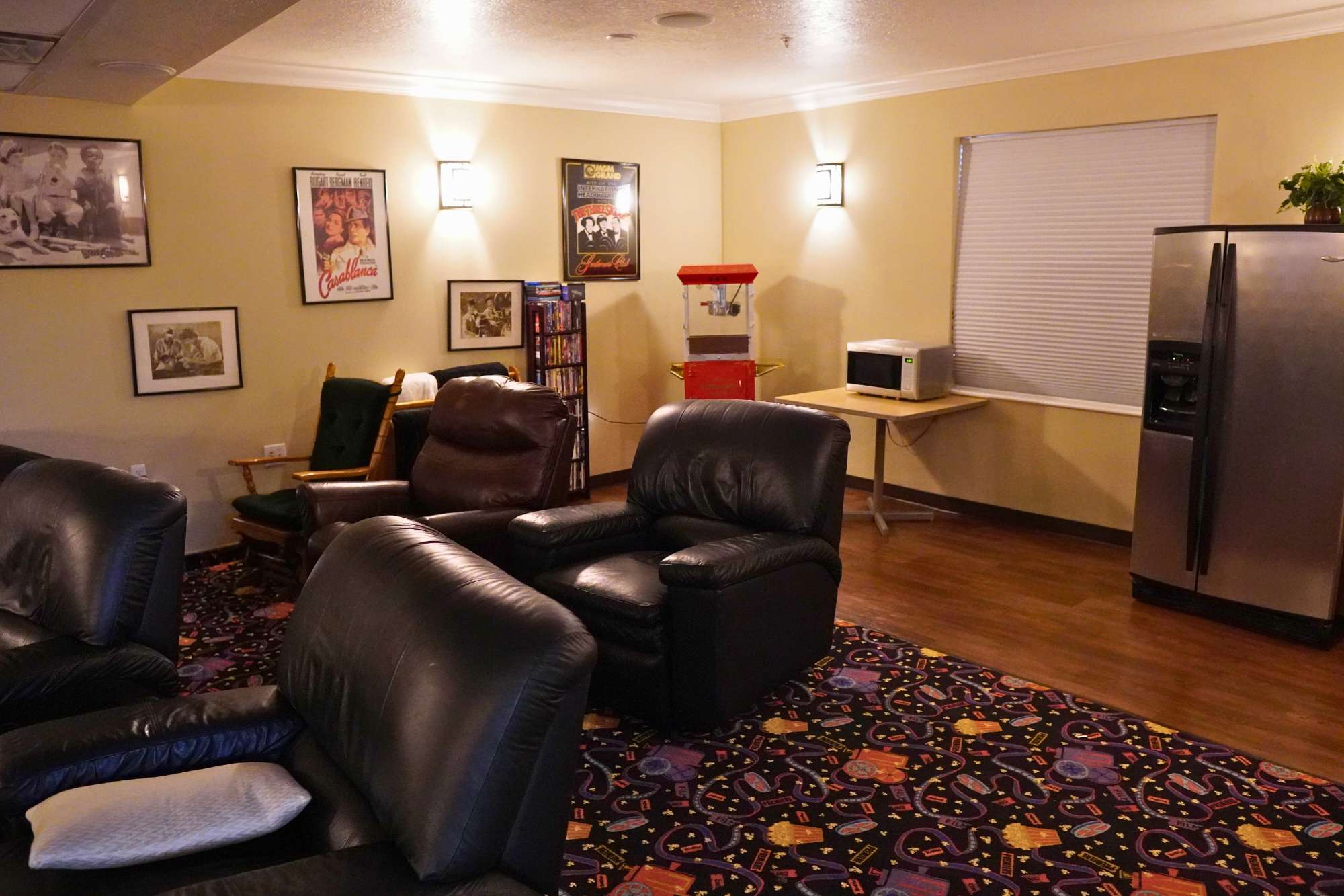 Theater room view 2 with popcorn machine at Abbington Manor in Lehi UT. Assisted Living & Memory Care Community