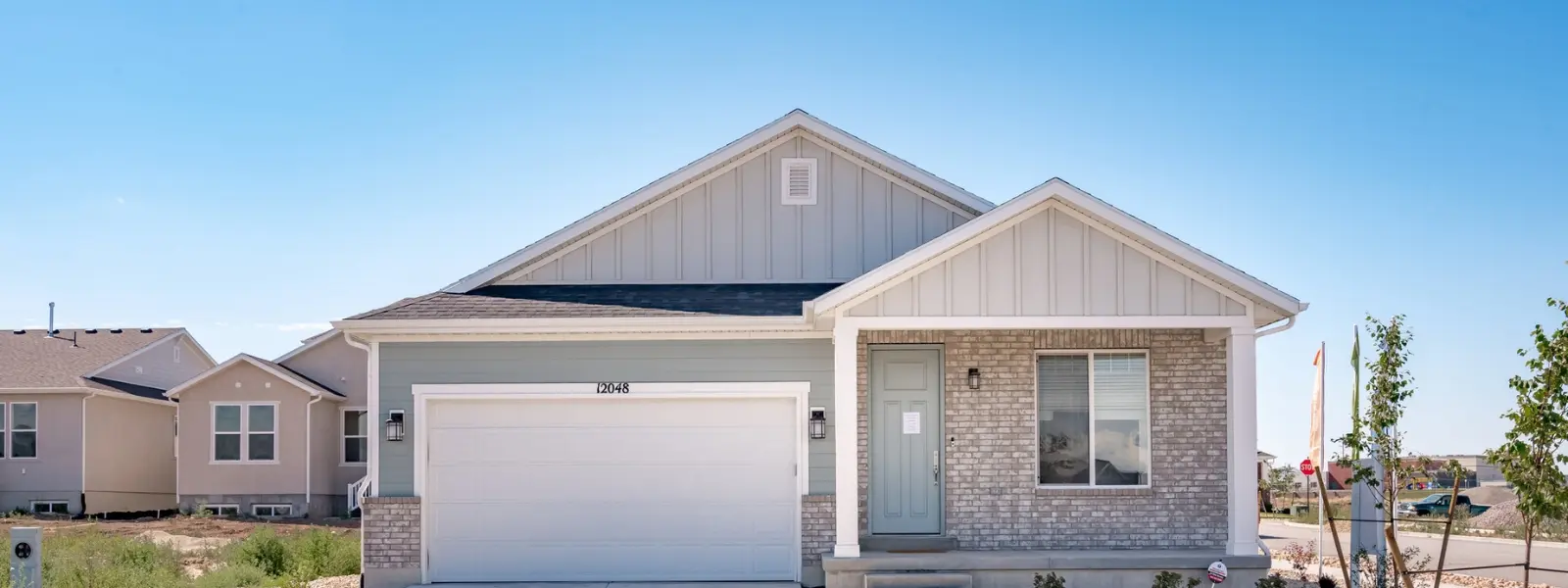 teton-village-header-image-herriman-ut (1) View of the front of Teton Village home in Herriman, UT