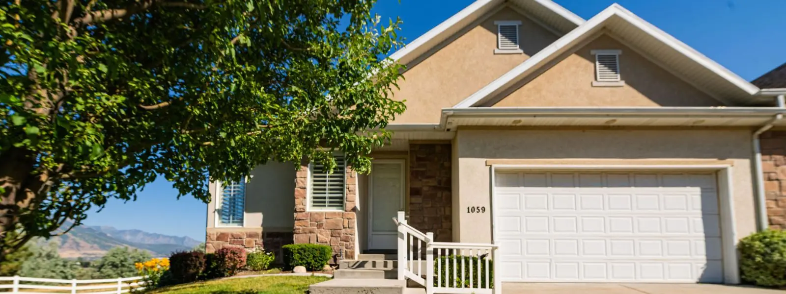 View of the front of a 55+ home in the Farms at tithing hill community in Riverton